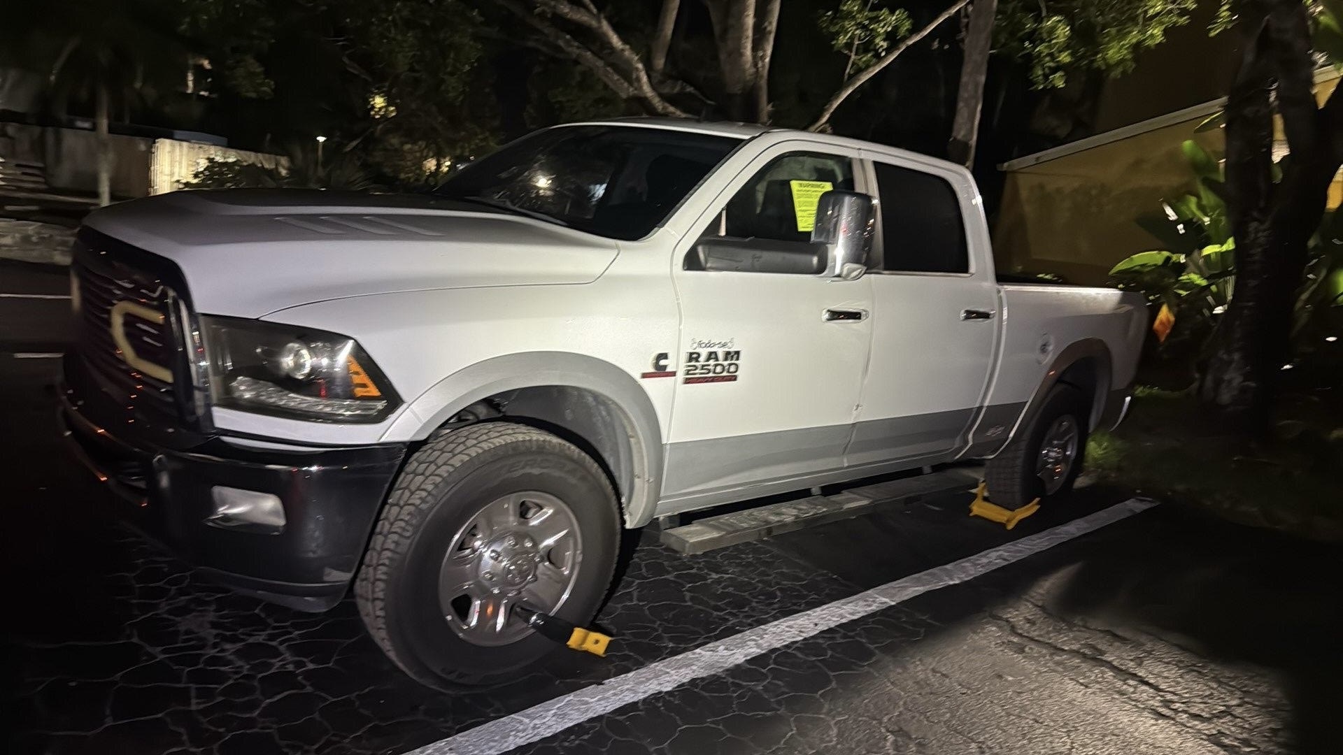 Truck immobilized at night with vehicle wheel lock